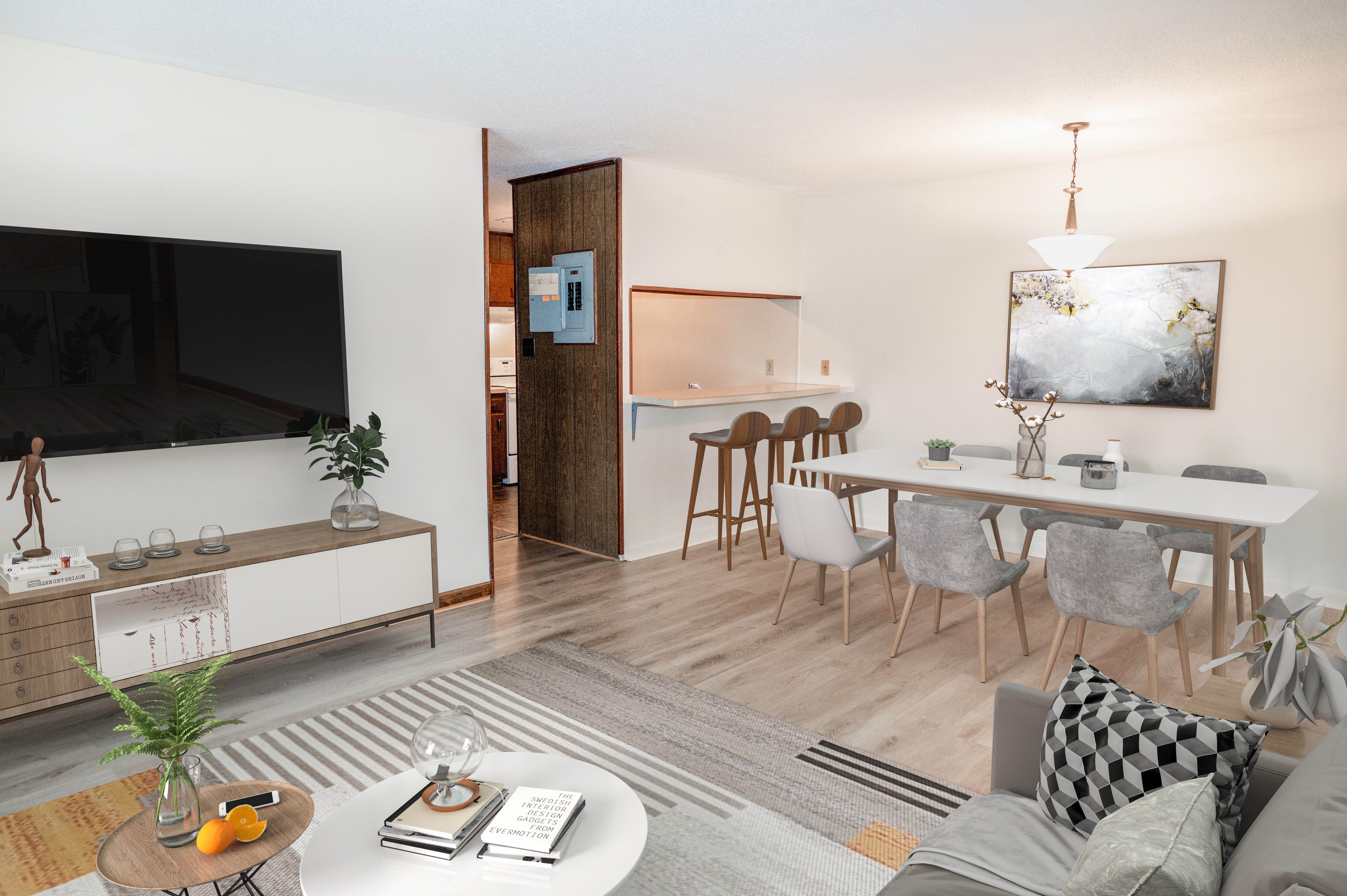 A modern living room with a television, a dining table, and a couch.